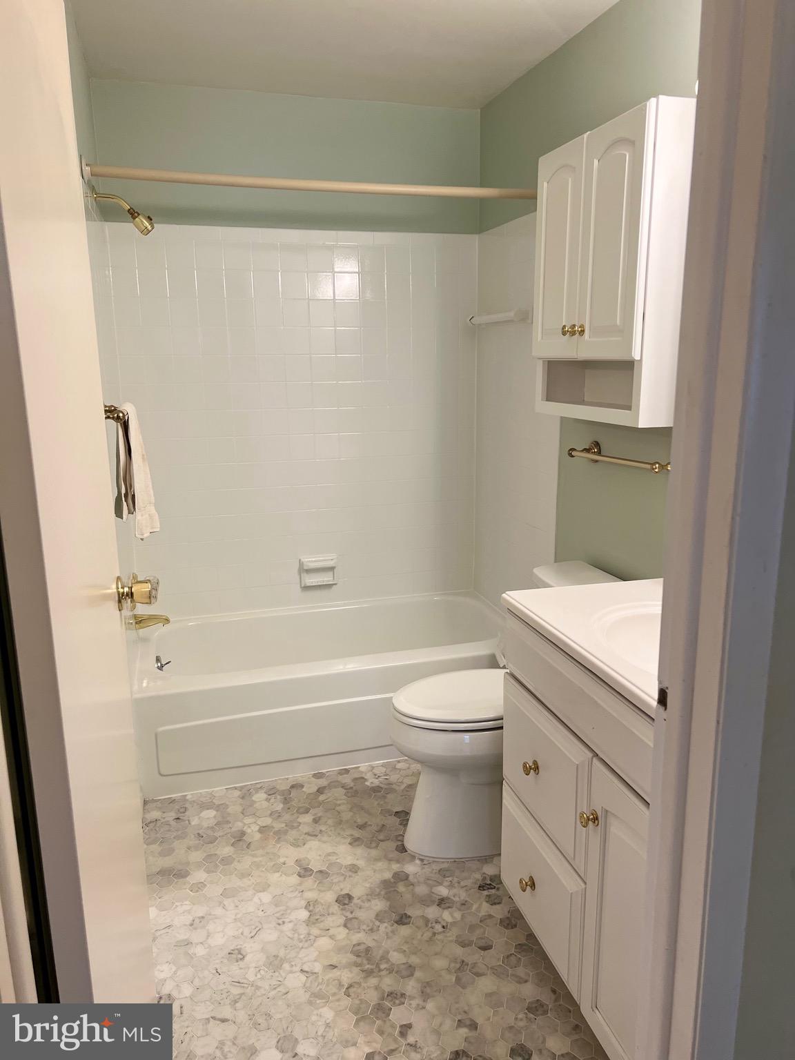 204 Pewter Lane Silver Spring, MD 20905 - Photo 5 of 12 a bathroom with a toilet and a shower