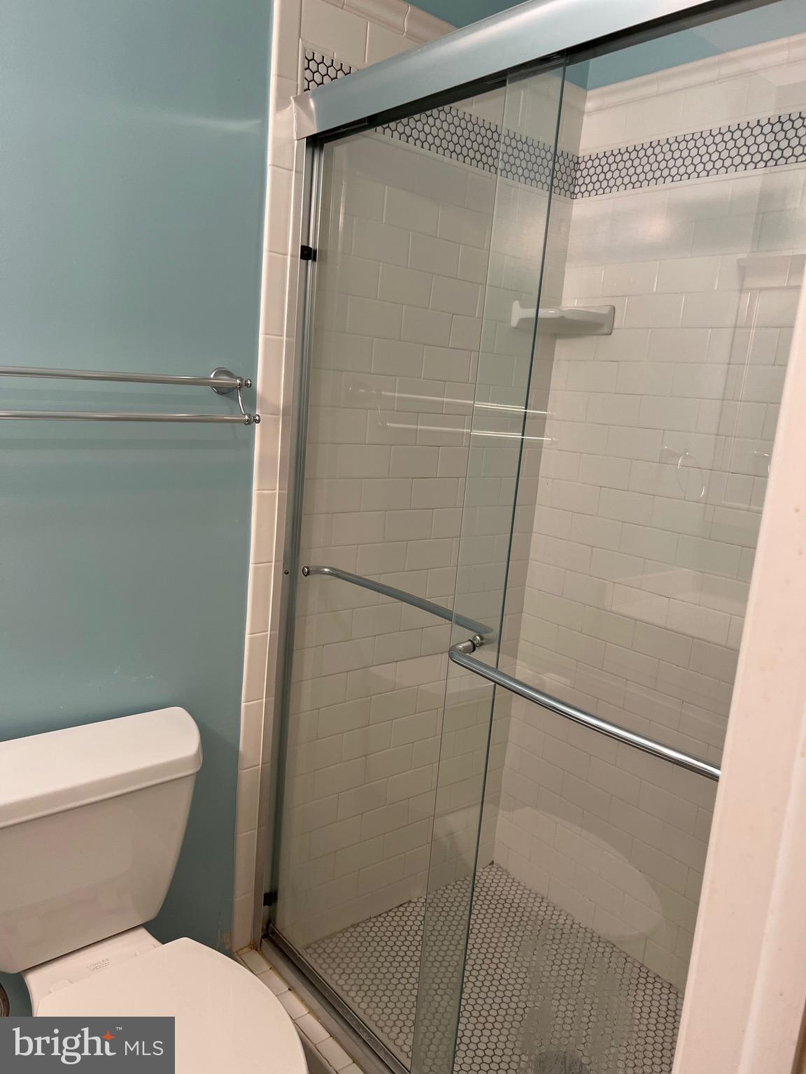 204 Pewter Lane Silver Spring, MD 20905 - Photo 8 of 12 a bathroom with a toilet and a shower