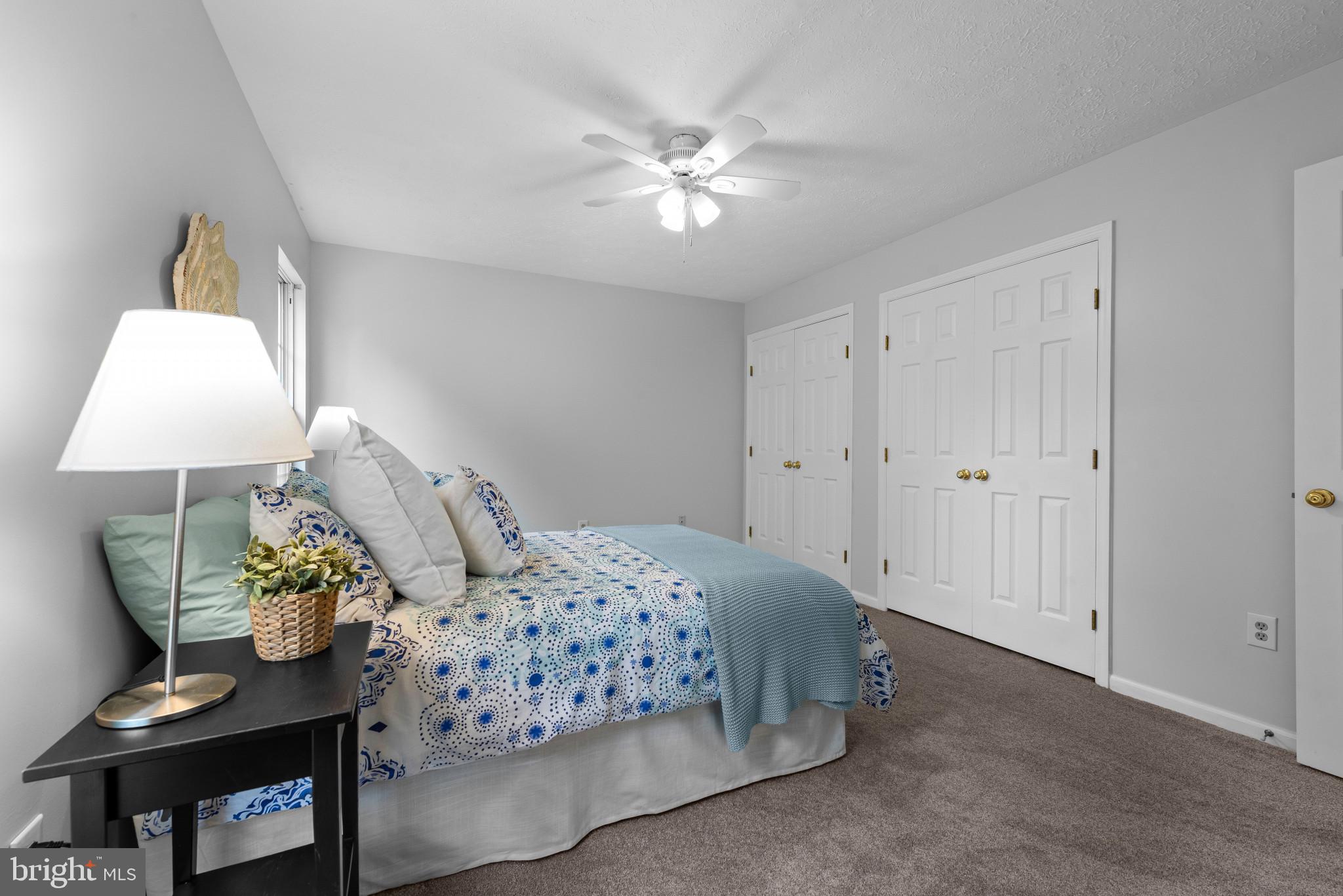 3107 Pouska Road Abingdon, MD 21009 - Photo 25 of 38 a bedroom with a bed and a lamp