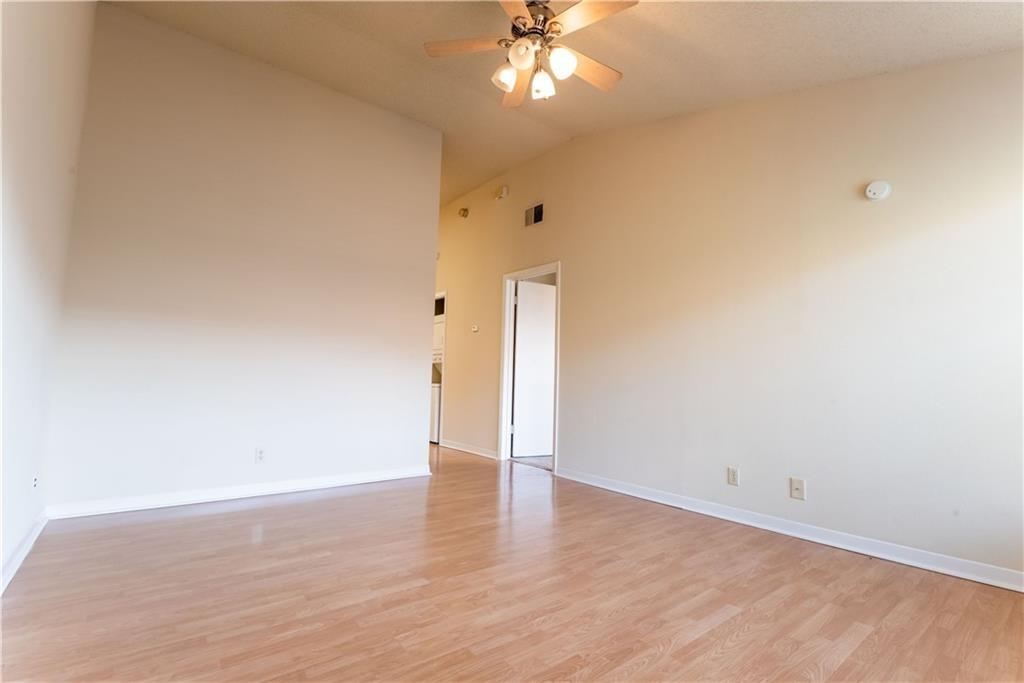 2216 San Gabriel Street, Unit 206 Austin, TX 78705 - Photo 2 of 11 a view of an empty room with wooden floor