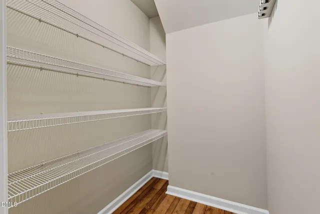a kitchen with granite countertop a refrigerator stove top oven and sink