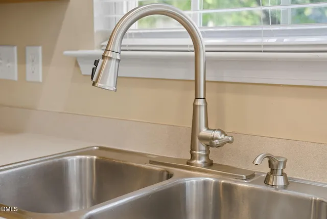 a kitchen with stainless steel appliances granite countertop a stove and a microwave