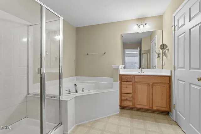 an empty room with closet and a ceiling fan