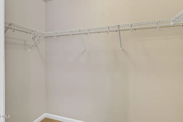 a bathroom with a bathtub sink vanity and mirror