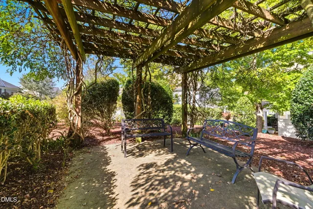 aerial view of a house with a garden and lake view
