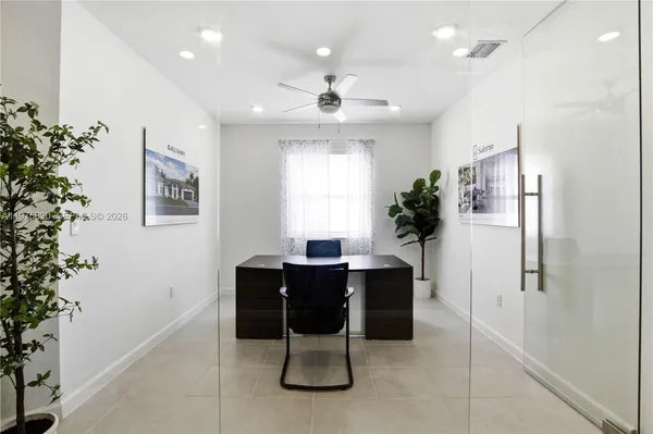 a workspace with furniture and window