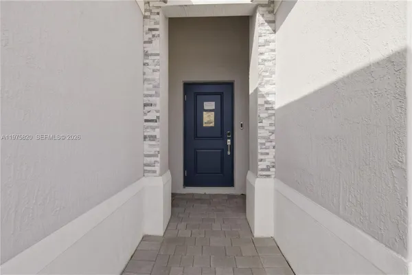 a view of a bathtub in a hallway