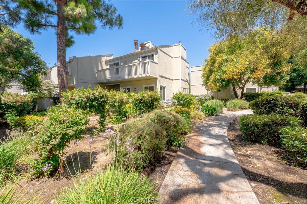 646 Sycamore Avenue, Unit 18 Claremont, CA 91711 - Photo 12 of 46 a view of a house with a yard and garden