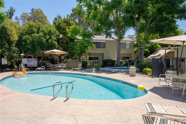 a view of a swimming pool with a patio