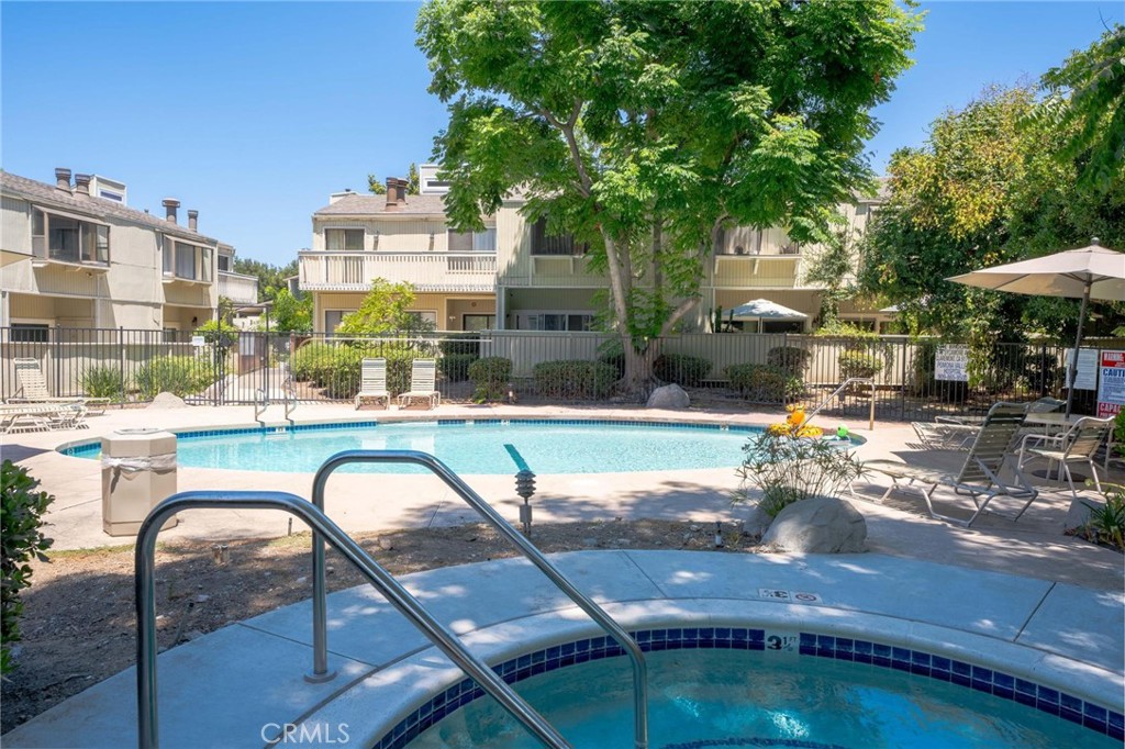 646 Sycamore Avenue, Unit 18 Claremont, CA 91711 - Photo 16 of 46 a view of a swimming pool with a patio