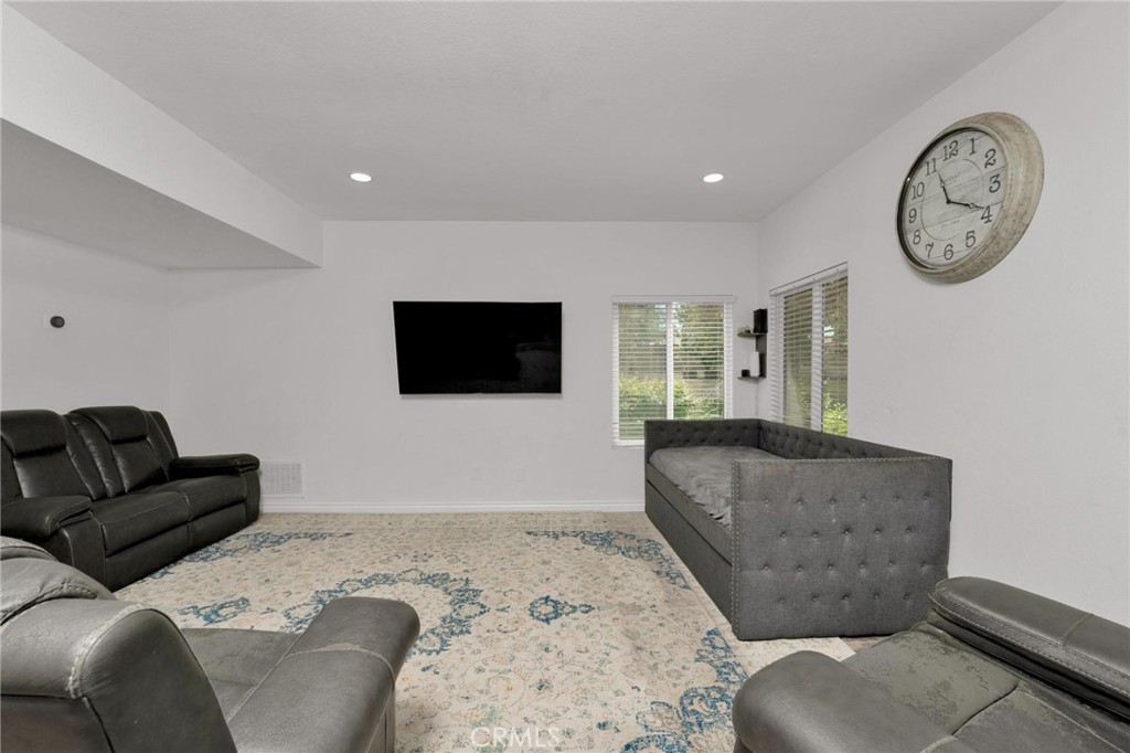 646 Sycamore Avenue, Unit 18 Claremont, CA 91711 - Photo 24 of 46 a living room with furniture and a flat screen tv