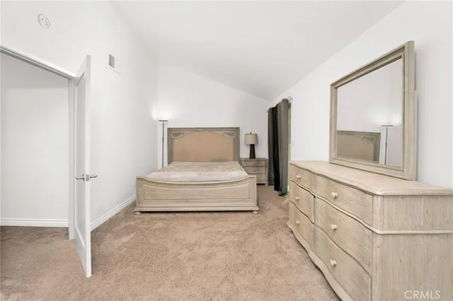 a view of a hallway with furniture and a fireplace