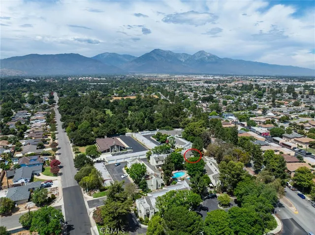 an aerial view of residential houses with outdoor space