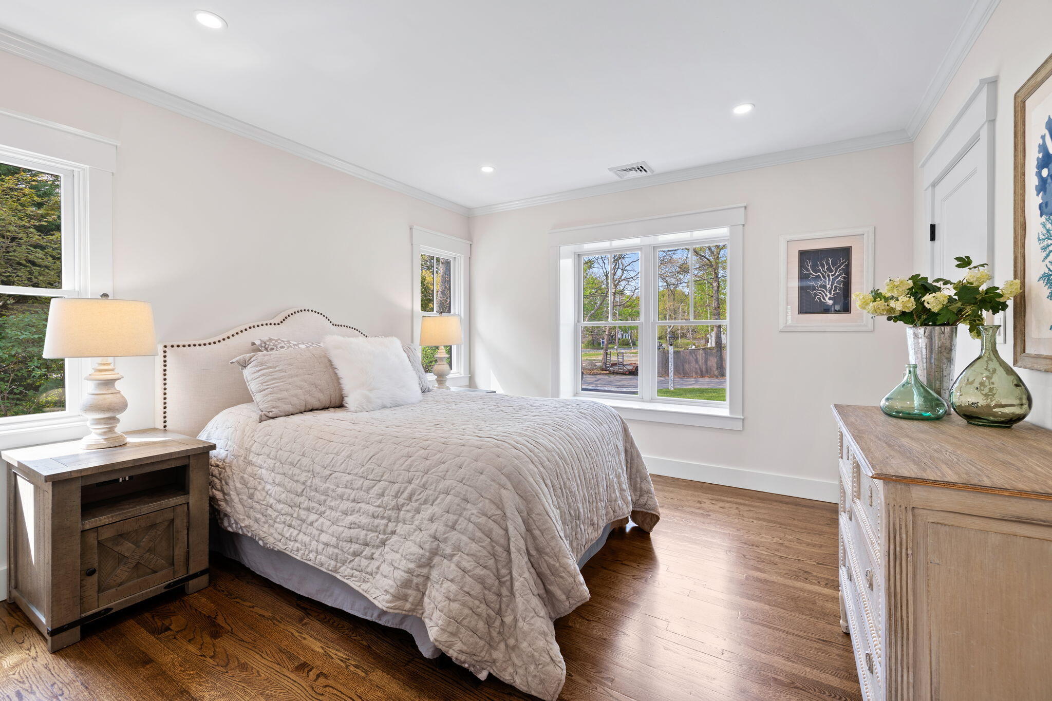 321 Tower Hill Road Osterville, MA 02655 - Photo 16 of 38 a bedroom with a bed and a potted plant