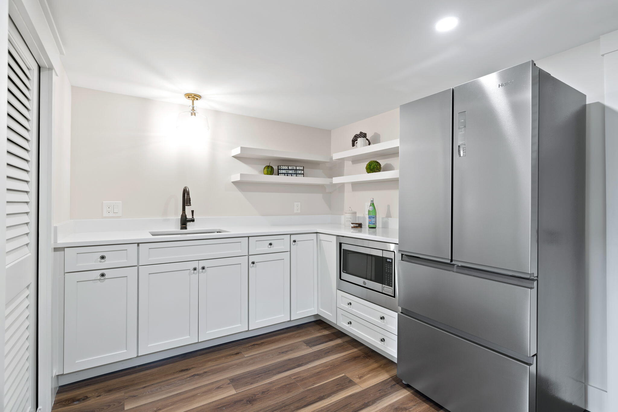 321 Tower Hill Road Osterville, MA 02655 - Photo 21 of 38 a kitchen with cabinets and stainless steel appliances