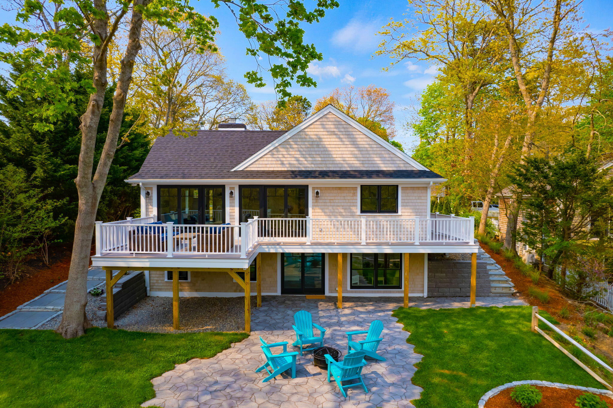 321 Tower Hill Road Osterville, MA 02655 - Photo 27 of 38 a front view of a house with a garden and porch