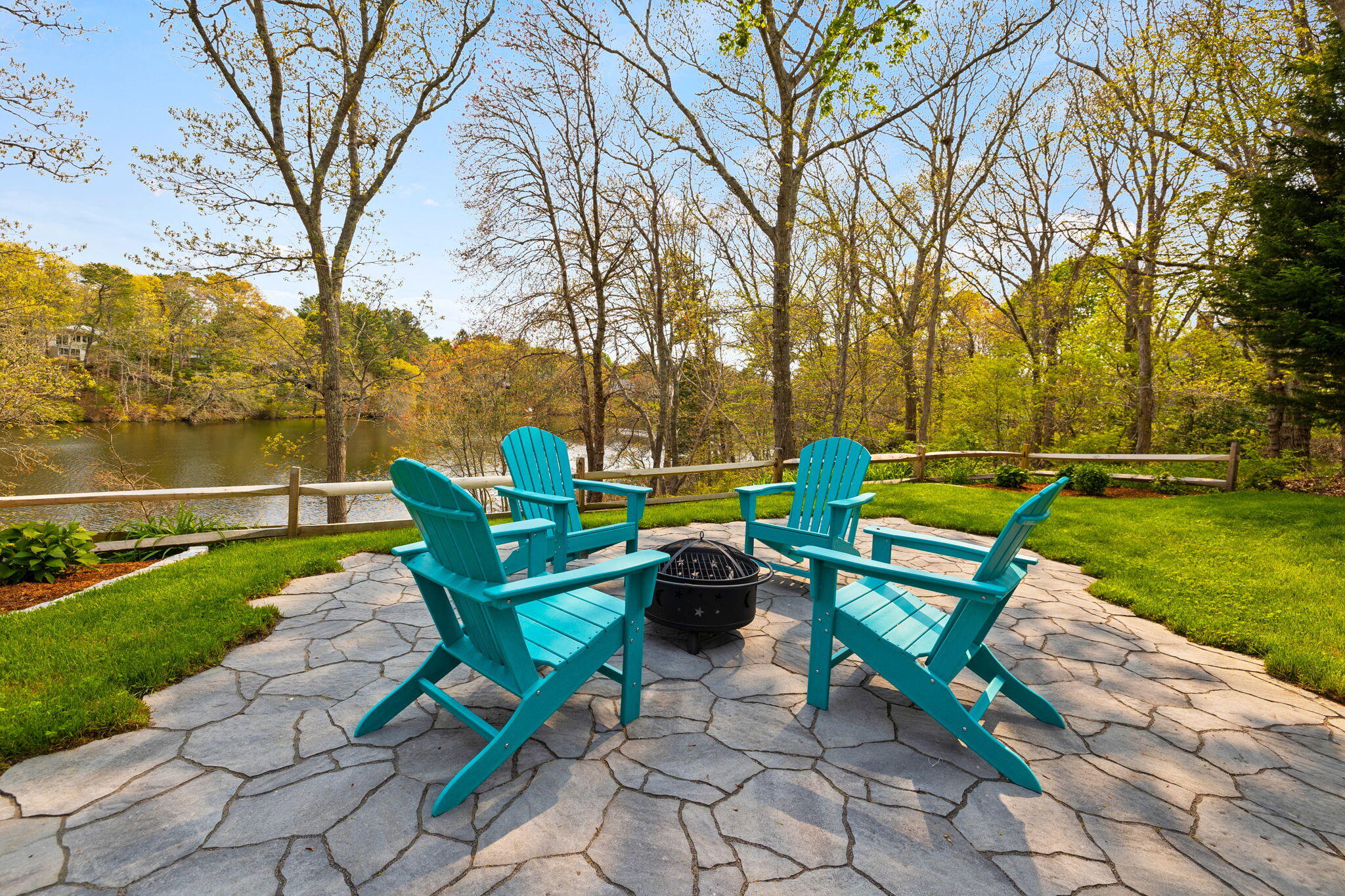 321 Tower Hill Road Osterville, MA 02655 - Photo 28 of 38 a green bench sitting in the middle of a park