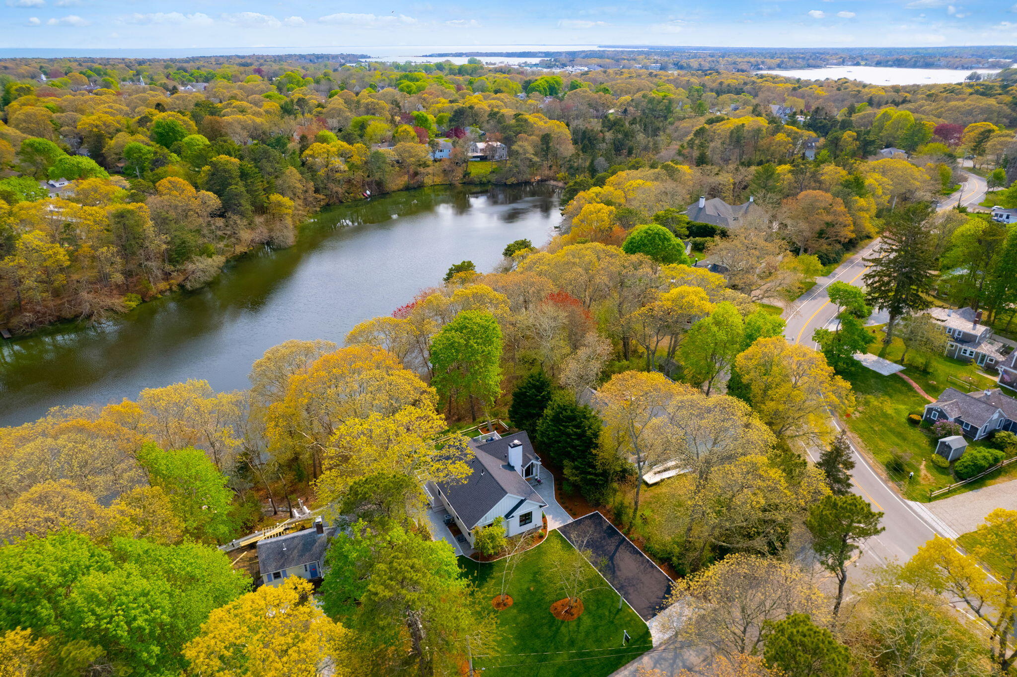 321 Tower Hill Road Osterville, MA 02655 - Photo 29 of 38 an aerial view of residential houses with outdoor space