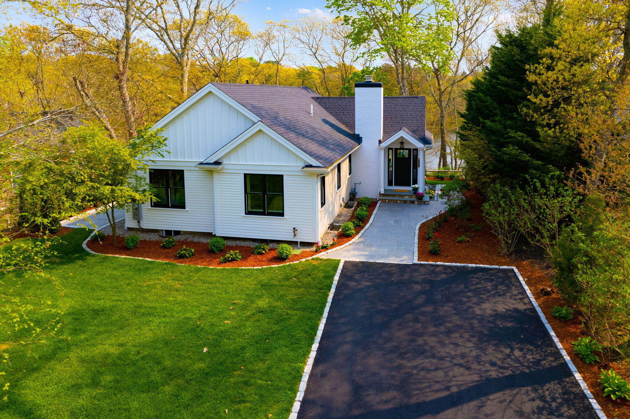321 Tower Hill Road Osterville, MA 02655 - Photo 30 of 38 a front view of house with yard and green space