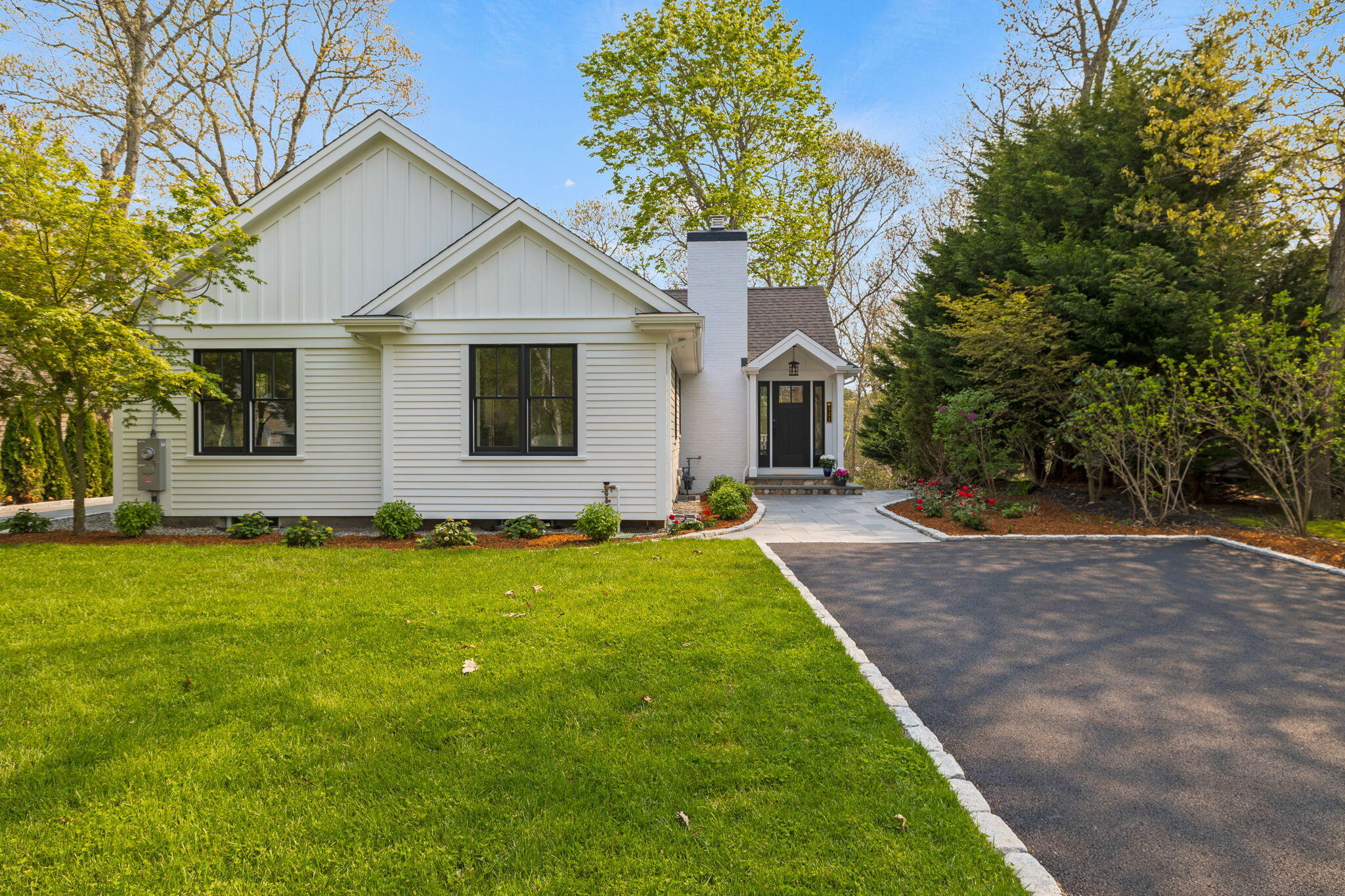 321 Tower Hill Road Osterville, MA 02655 - Photo 31 of 38 a front view of house with yard and green space