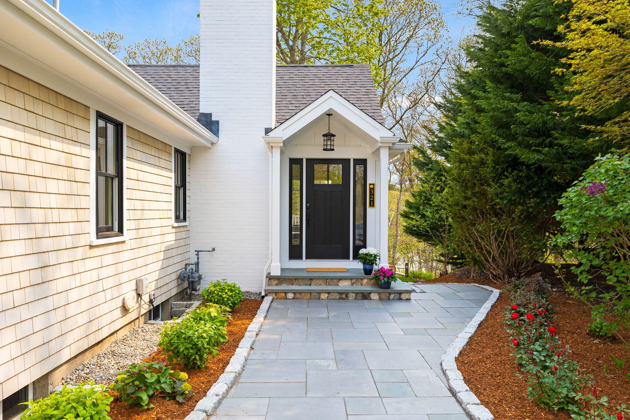 321 Tower Hill Road Osterville, MA 02655 - Photo 32 of 38 a view of a house with potted plants