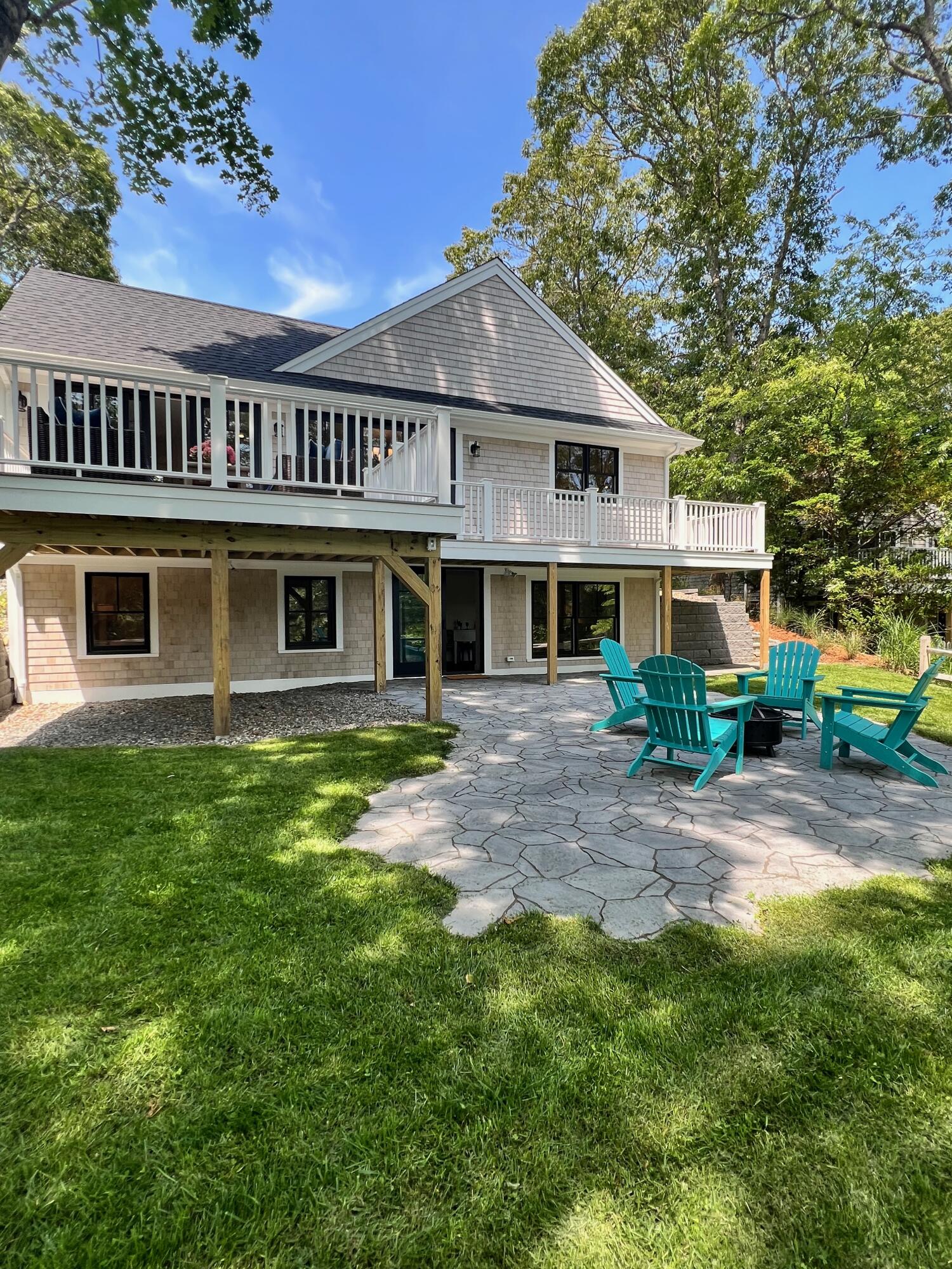 321 Tower Hill Road Osterville, MA 02655 - Photo 38 of 38 a front view of a house with a garden
