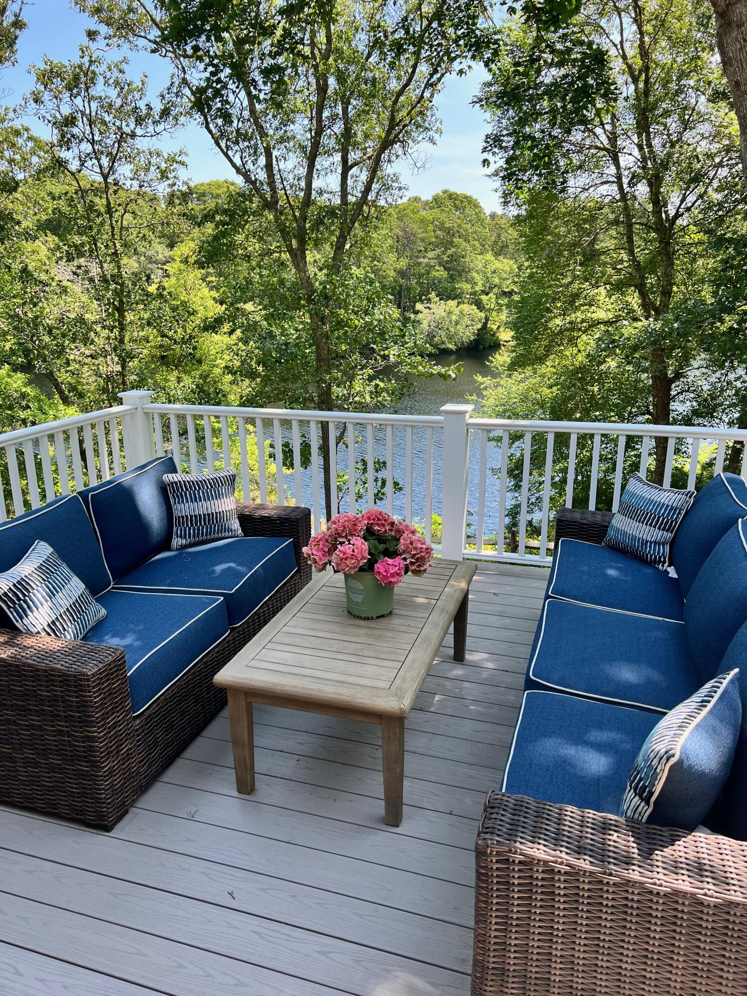 321 Tower Hill Road Osterville, MA 02655 - Photo 6 of 38 a view of deck that has couches and table with wooden floor and fence