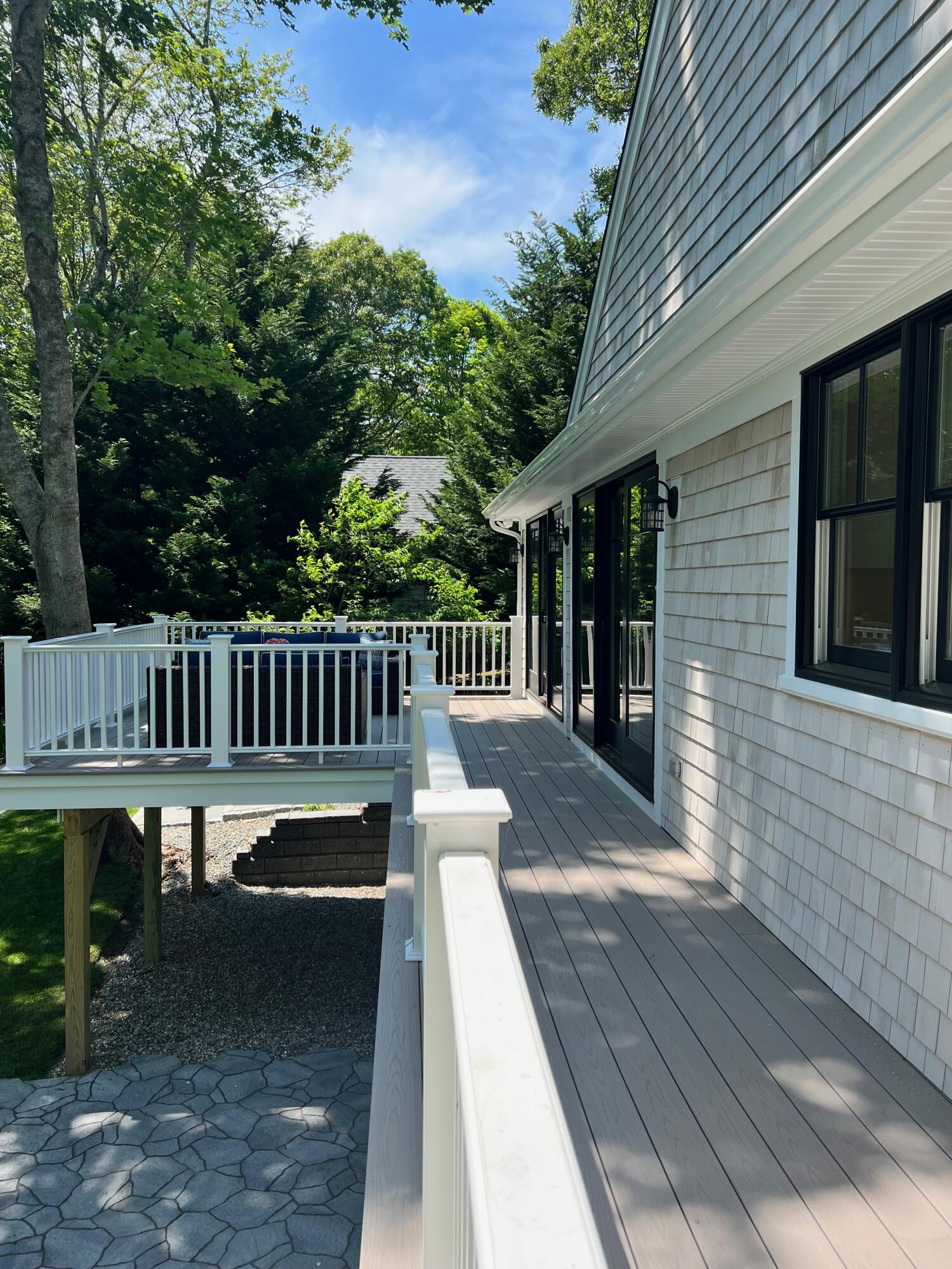 321 Tower Hill Road Osterville, MA 02655 - Photo 7 of 38 a view of a deck with two chair and table