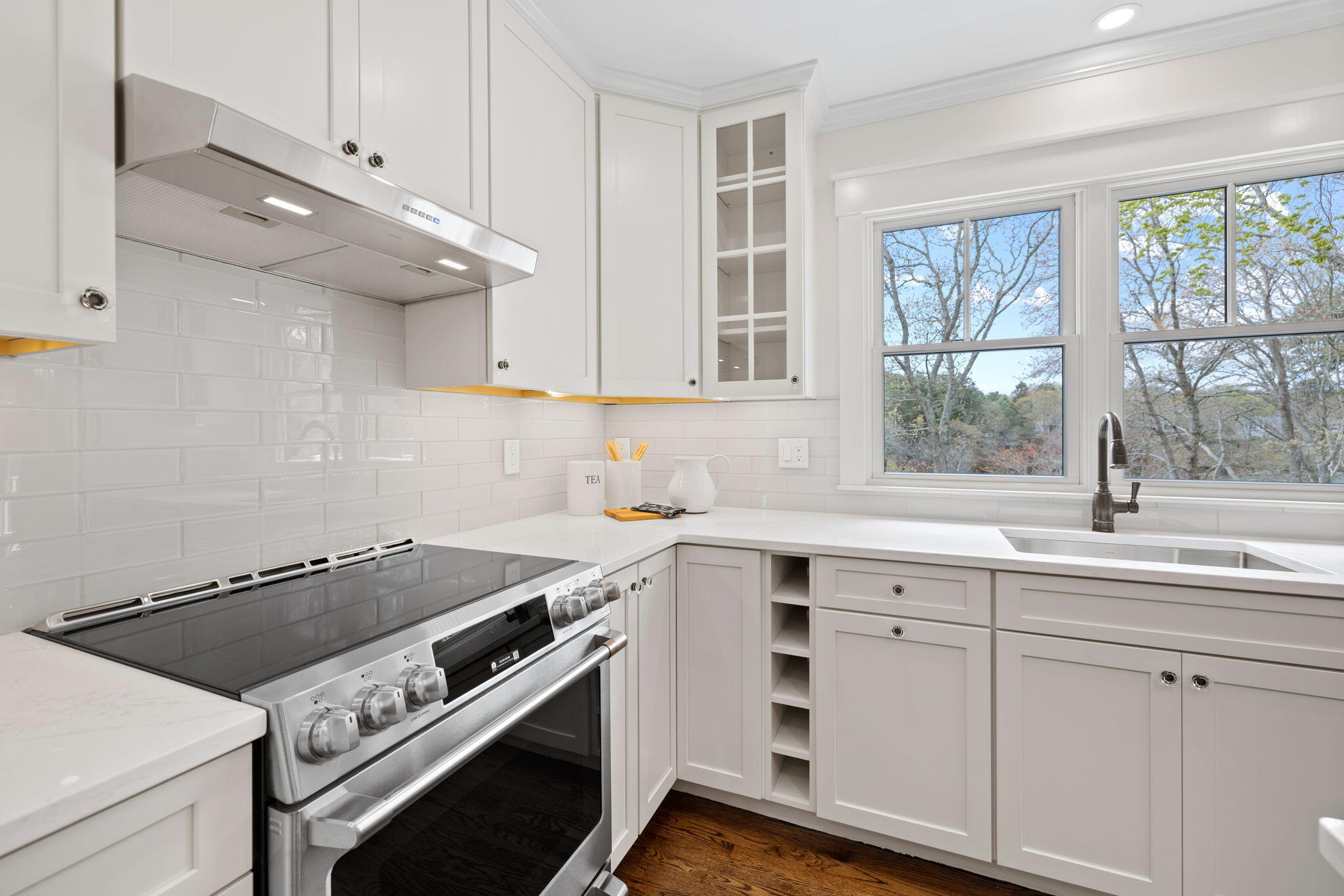 321 Tower Hill Road Osterville, MA 02655 - Photo 10 of 38 a view of a kitchen with a sink dishwasher and wooden floor