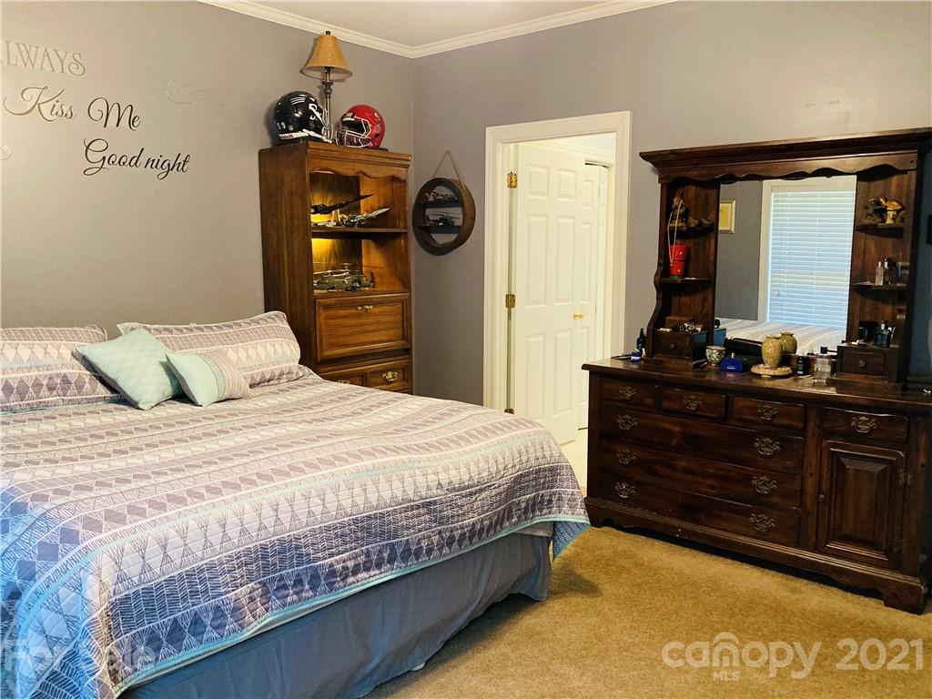 470 Duncard Church Road Rutherfordton, NC 28139 - Photo 12 of 43 a bedroom with a bed and a dresser