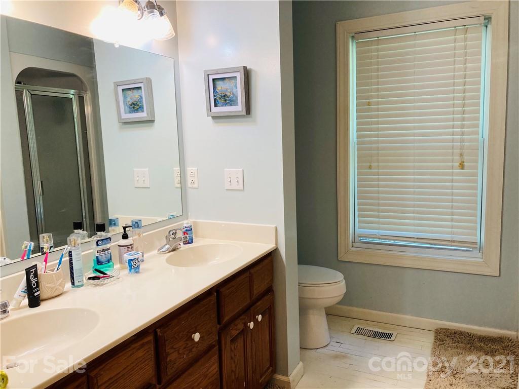 470 Duncard Church Road Rutherfordton, NC 28139 - Photo 15 of 43 a bathroom with a sink double vanity and a toilet