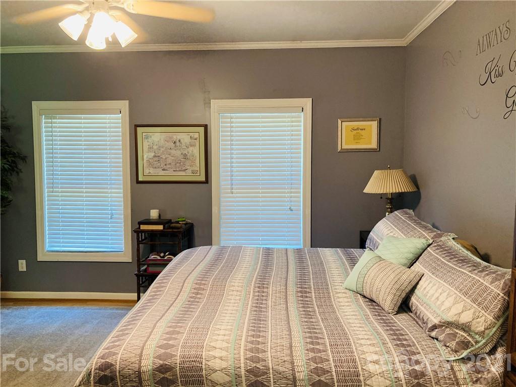 470 Duncard Church Road Rutherfordton, NC 28139 - Photo 18 of 43 a bedroom with a bed and wooden floor