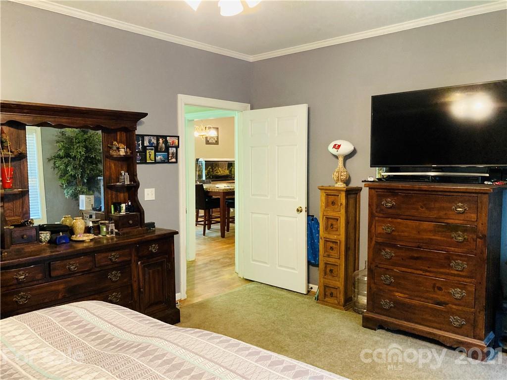 470 Duncard Church Road Rutherfordton, NC 28139 - Photo 19 of 43 a bedroom with a bed and a flat screen tv