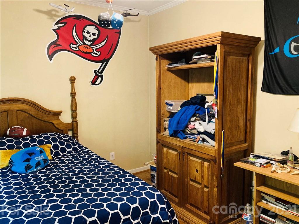470 Duncard Church Road Rutherfordton, NC 28139 - Photo 26 of 43 a bedroom with a bed and a dresser