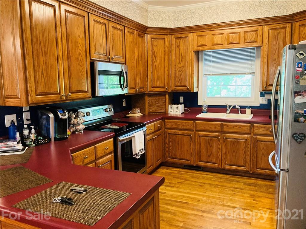 470 Duncard Church Road Rutherfordton, NC 28139 - Photo 7 of 43 a kitchen with stainless steel appliances a sink counter space and a window