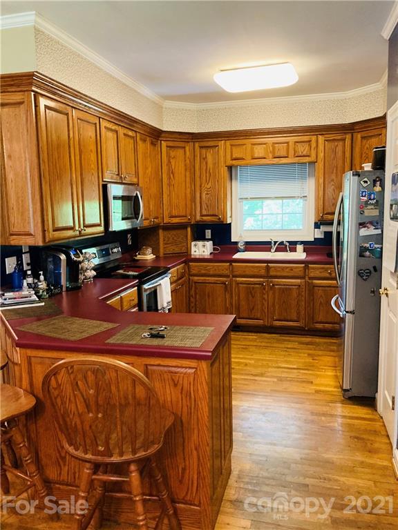 470 Duncard Church Road Rutherfordton, NC 28139 - Photo 9 of 43 a kitchen with stainless steel appliances granite countertop a sink stove and refrigerator