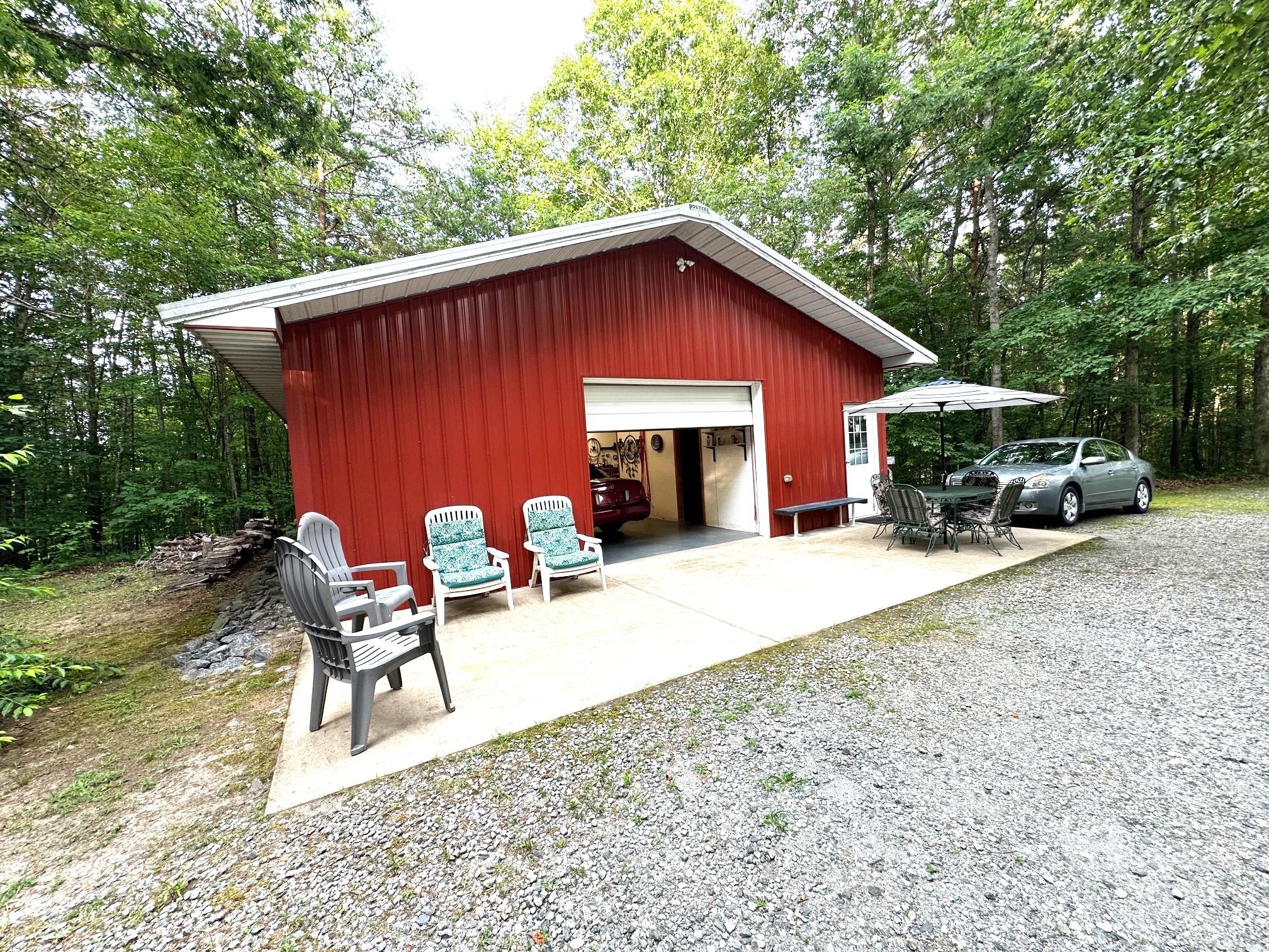 251 Rainbow Rapids Road Rutherfordton, NC 28139 - Photo 6 of 45 a view of a house with backyard and sitting area