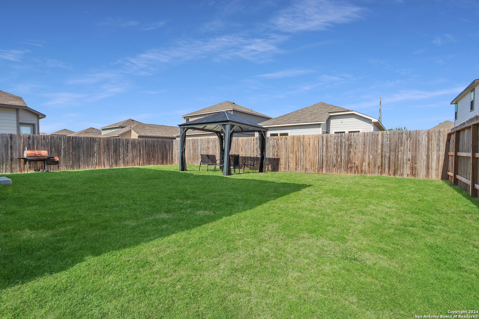 2425 Marty Way Seguin, TX 78155 - Photo 22 of 22 a view of a big house with a big yard and large trees
