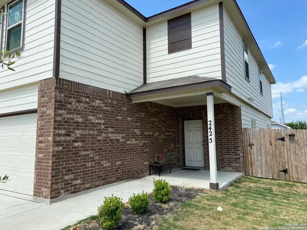 a front view of a house with a garage