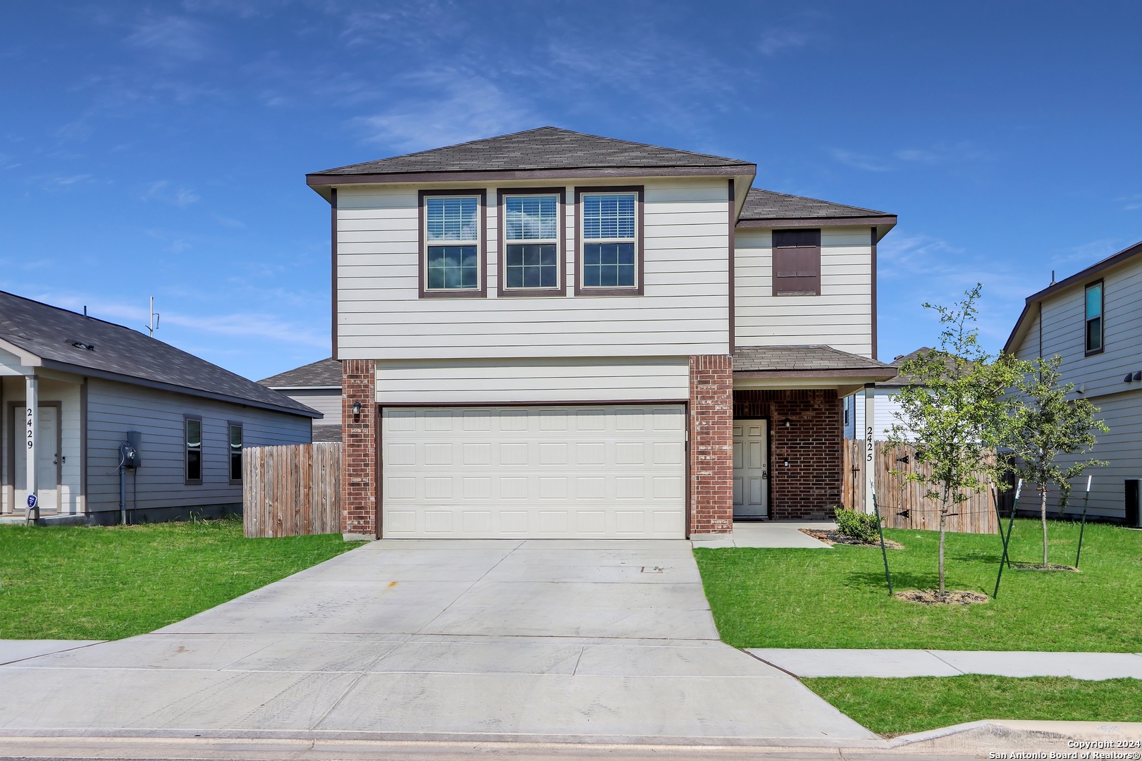 2425 Marty Way Seguin, TX 78155 - Photo 6 of 22 a front view of a house with a yard and garage