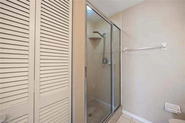 a bathroom with a shower and a sink