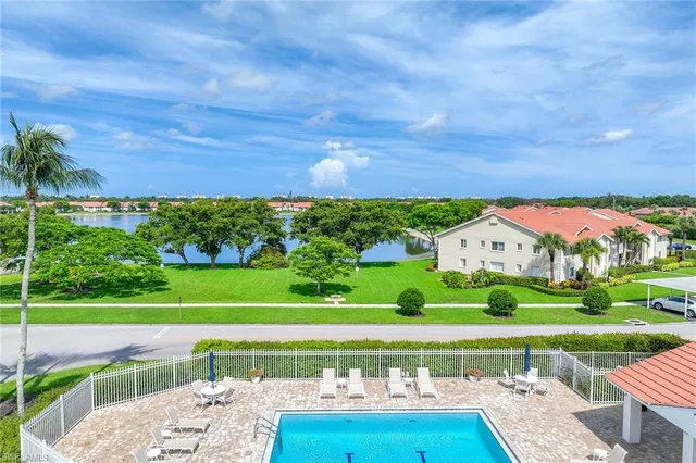 a view of a big house with a big yard
