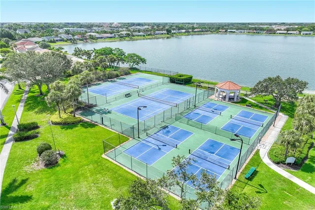 an aerial view of a house with a lake view