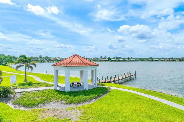a view of a house with swimming pool and a yard