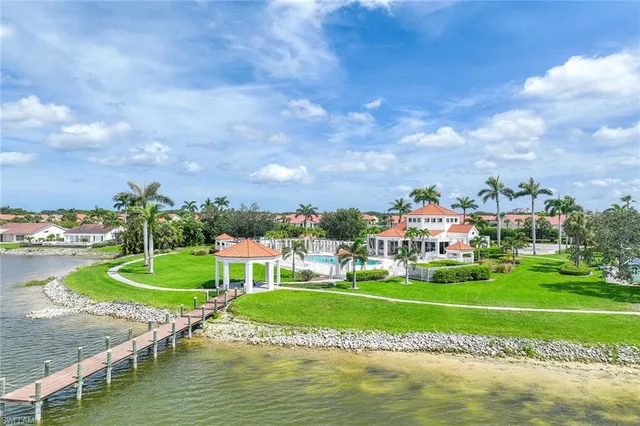 a view of a swimming pool with a house in the background