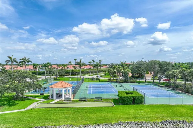 a view of a lake with a house in the background