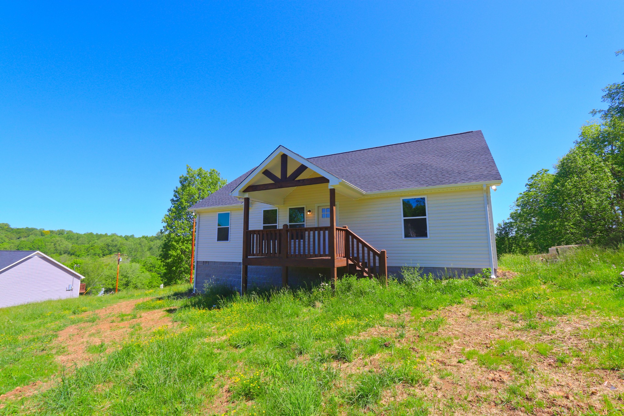 512 Highland Park Road Red Boiling Springs, TN 37150 - Photo 1 of 18 a view of a house with a yard and sitting area