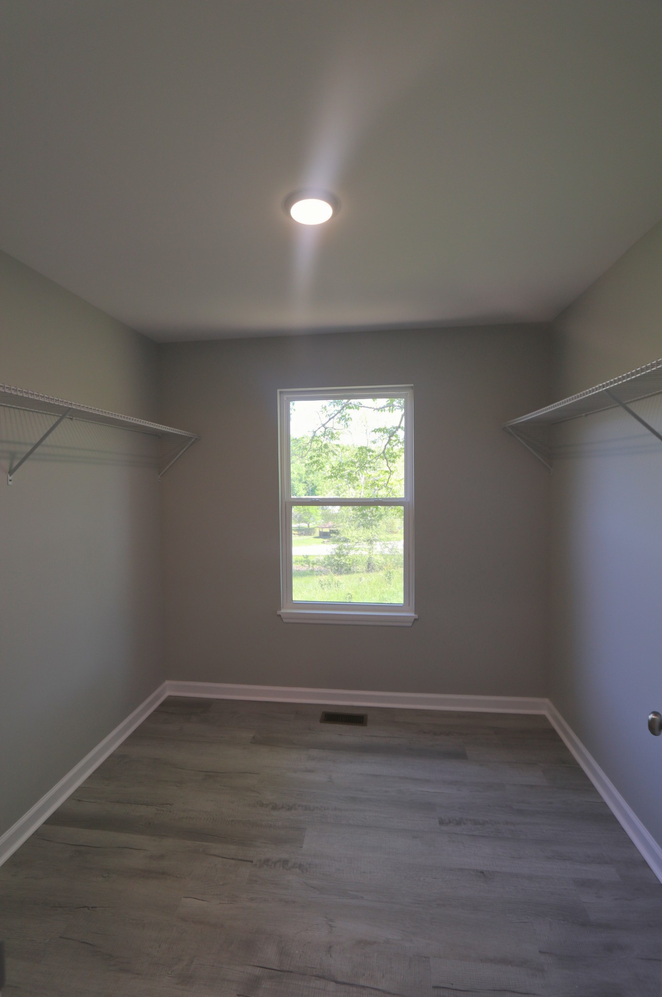512 Highland Park Road Red Boiling Springs, TN 37150 - Photo 11 of 18 wooden floor in an empty room with a window