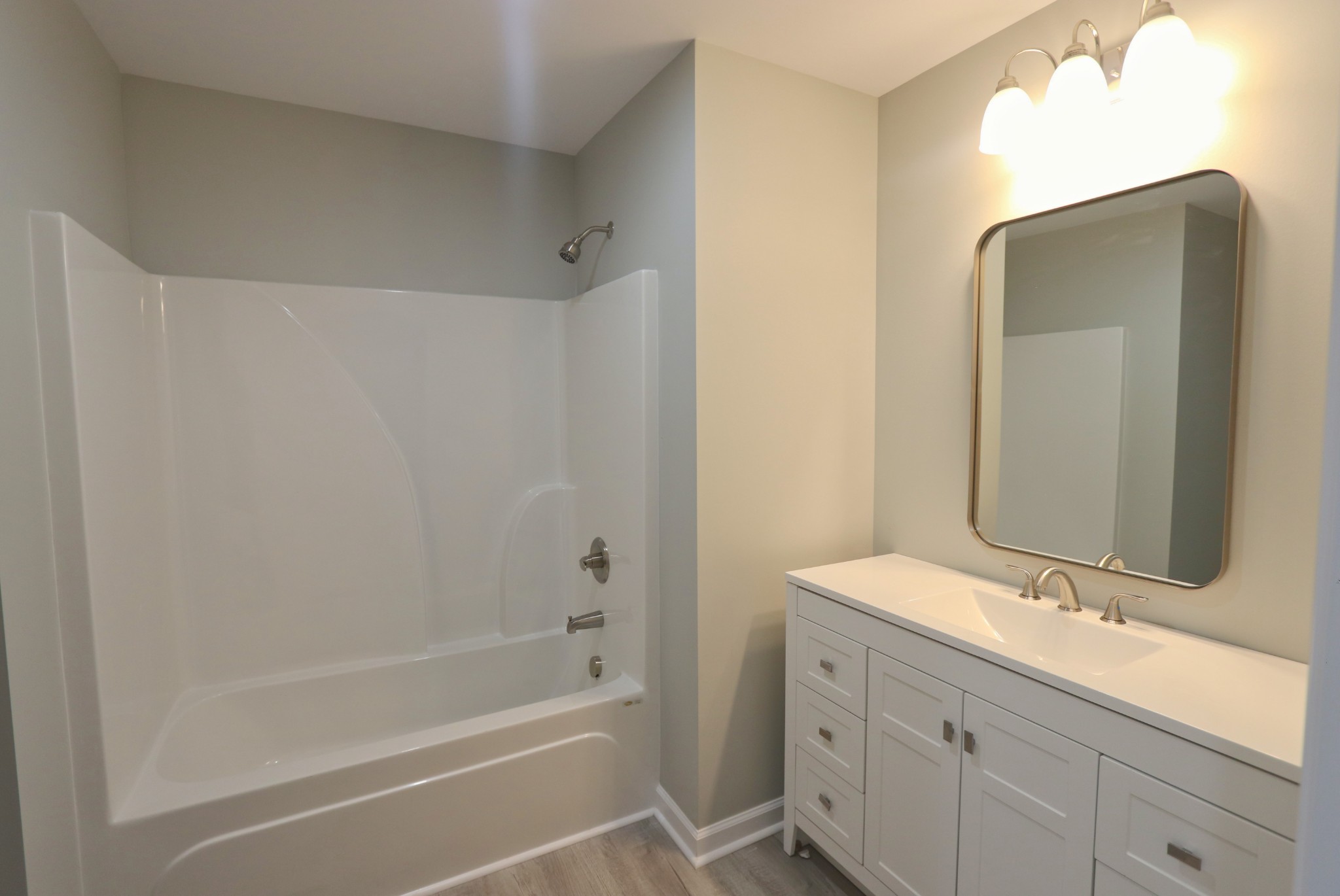 512 Highland Park Road Red Boiling Springs, TN 37150 - Photo 13 of 18 a bathroom with a bathtub sink vanity and mirror
