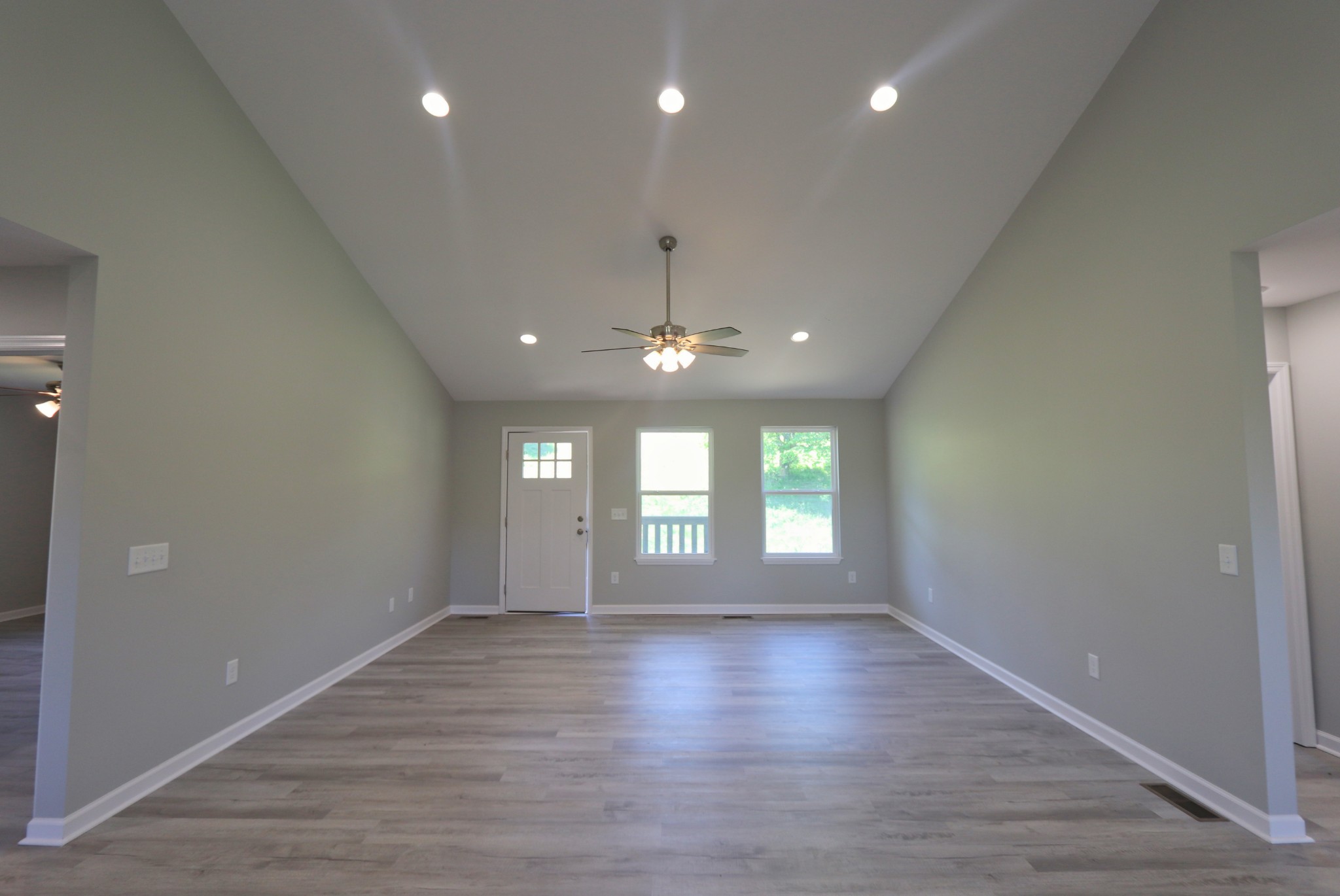 512 Highland Park Road Red Boiling Springs, TN 37150 - Photo 8 of 18 an empty room with wooden floor and windows